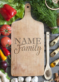 Custom laser engraved family name cutting board paddle