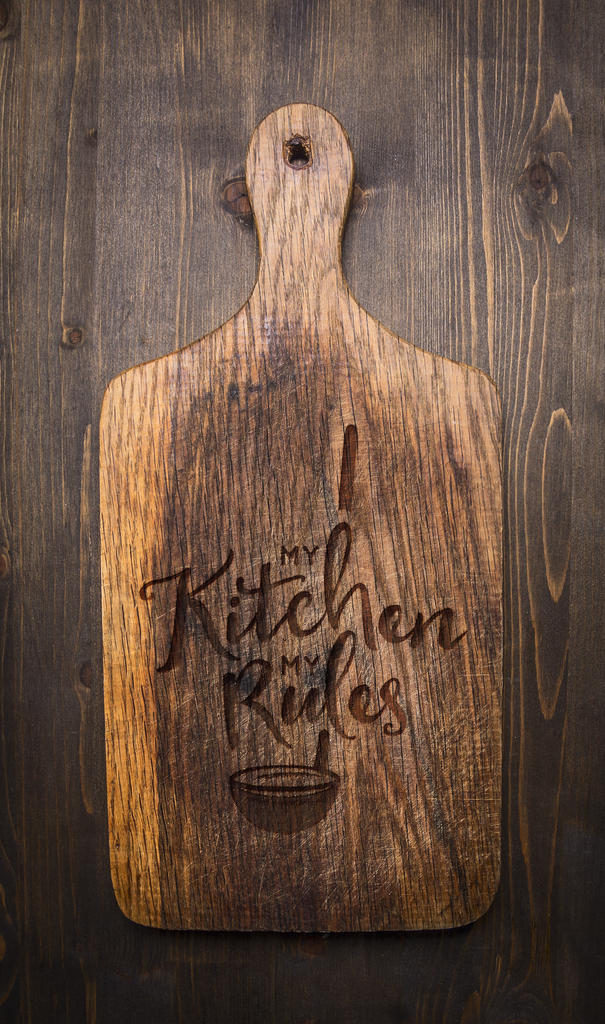 My Kitchen rules laser engraved on paddle cutting board